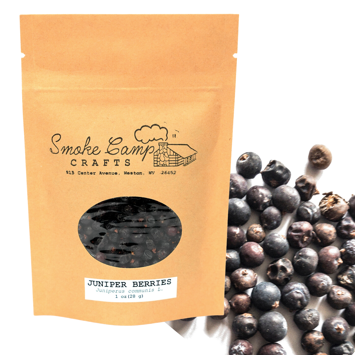 A Smoke Camp Crafts pouch labeled "Juniper Berries, Dried - 1 oz or 4 oz" (Juniperus communis) displays the berries through a clear window, with several loose herbal remedy berries scattered beside it on a white surface.