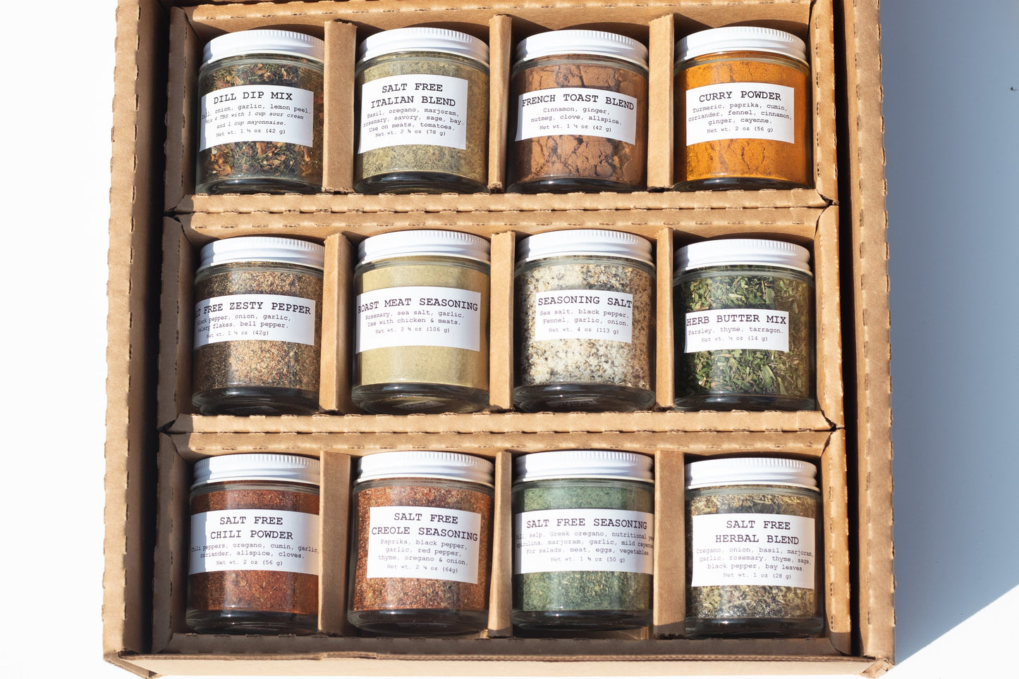 The Smoke Camp Crafts 12 Pack Gift Set features eco-friendly spice jars with handcrafted blends like dill dip mix, curry powder, French toast blend, and salt-free chili powder—a perfect chef’s gift set from Smoke Camp Crafts.