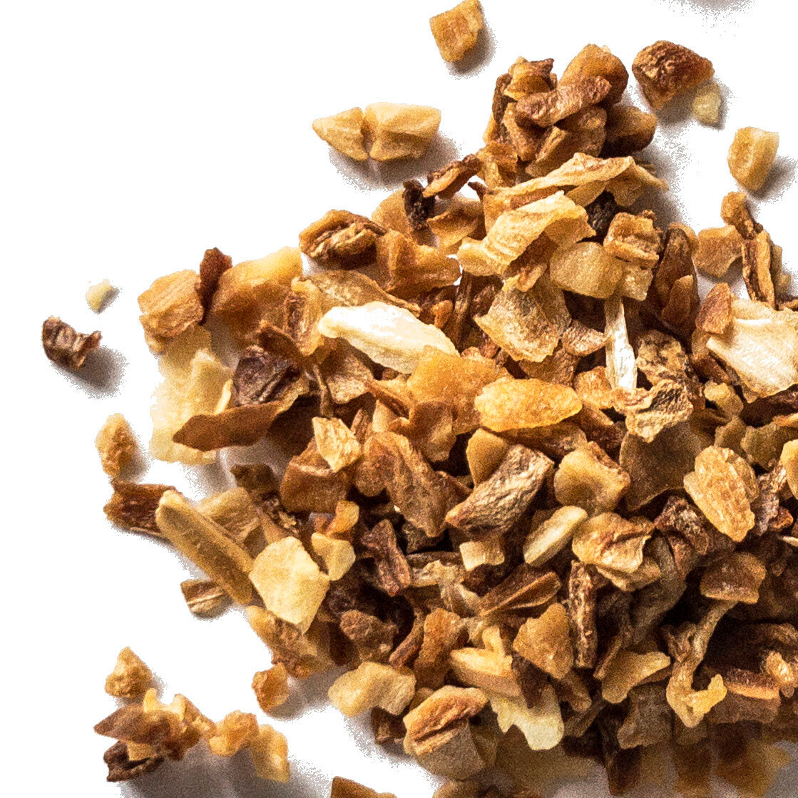 A close-up of Smoke Camp Crafts Onion Flakes, Dried (1 oz or 4 oz), shows golden brown and tan pieces made from dried Allium cepa onions, scattered on white and highlighting their irregular, crunchy texture.