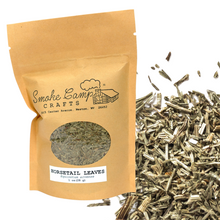 A Smoke Camp Crafts Horsetail Leaves, Dried (1 oz or 4 oz) package sits next to a pile of Equisetum arvense for urinary support. The brown bag features a window displaying the dried leaves inside.