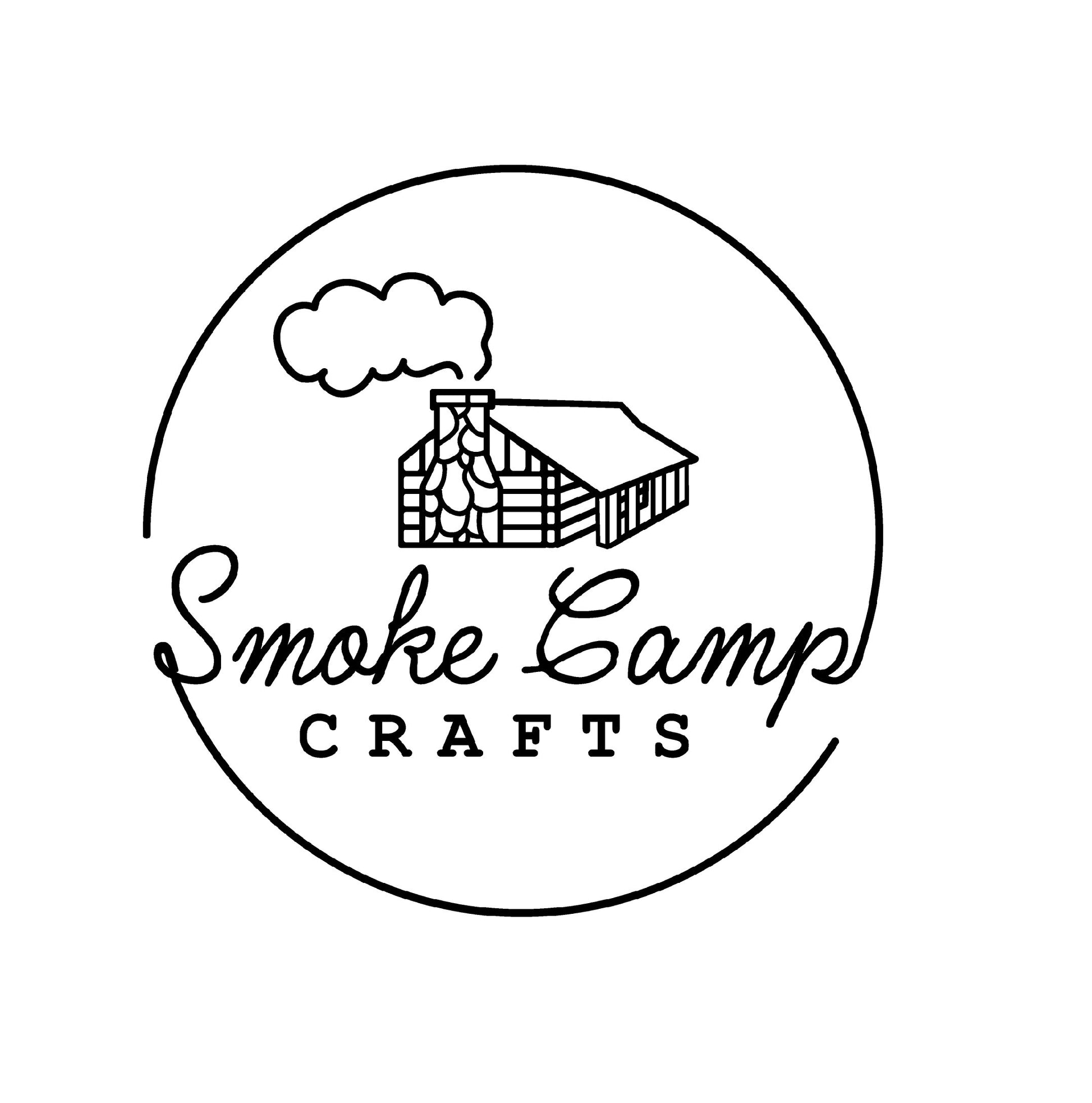 Black and white logo with a log cabin and smoke, encircled by a thin line. Text below: Smoke Camp in script, CRAFTS in block letters—ideal for Lemon Peel Granules, 1oz from Smoke Camp Crafts.