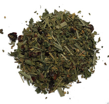A pile of Smoke Camp Crafts Mint Medley, 1 oz (28 g) herbal tea blend with dried green leaves, stems, and fruit pieces—rich in vitamin C—displayed on a white background.