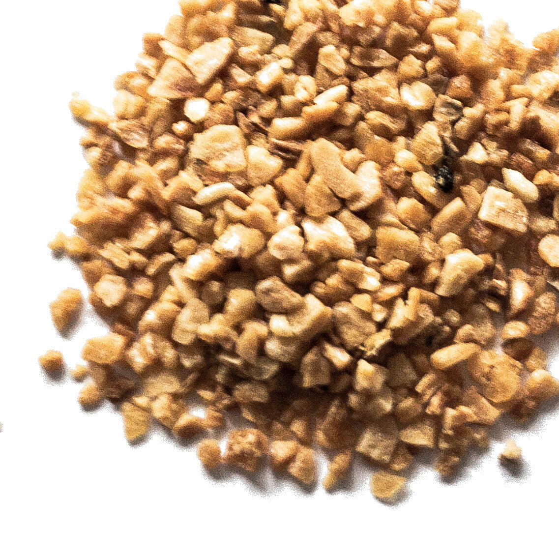 A close-up of a small pile of Smoke Camp Crafts Garlic Flakes—golden-brown, finely chopped dried garlic pieces—arranged on a white background.